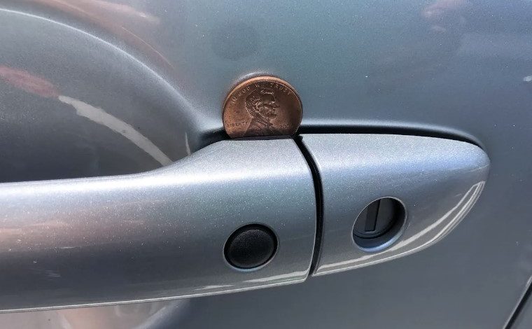 Here’s what it means if you spot a penny lodged in your car door handle