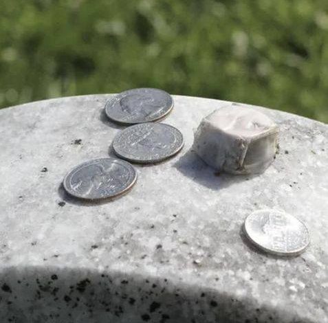 If you find a coin on a loved one’s gravestone, you had better know what it means