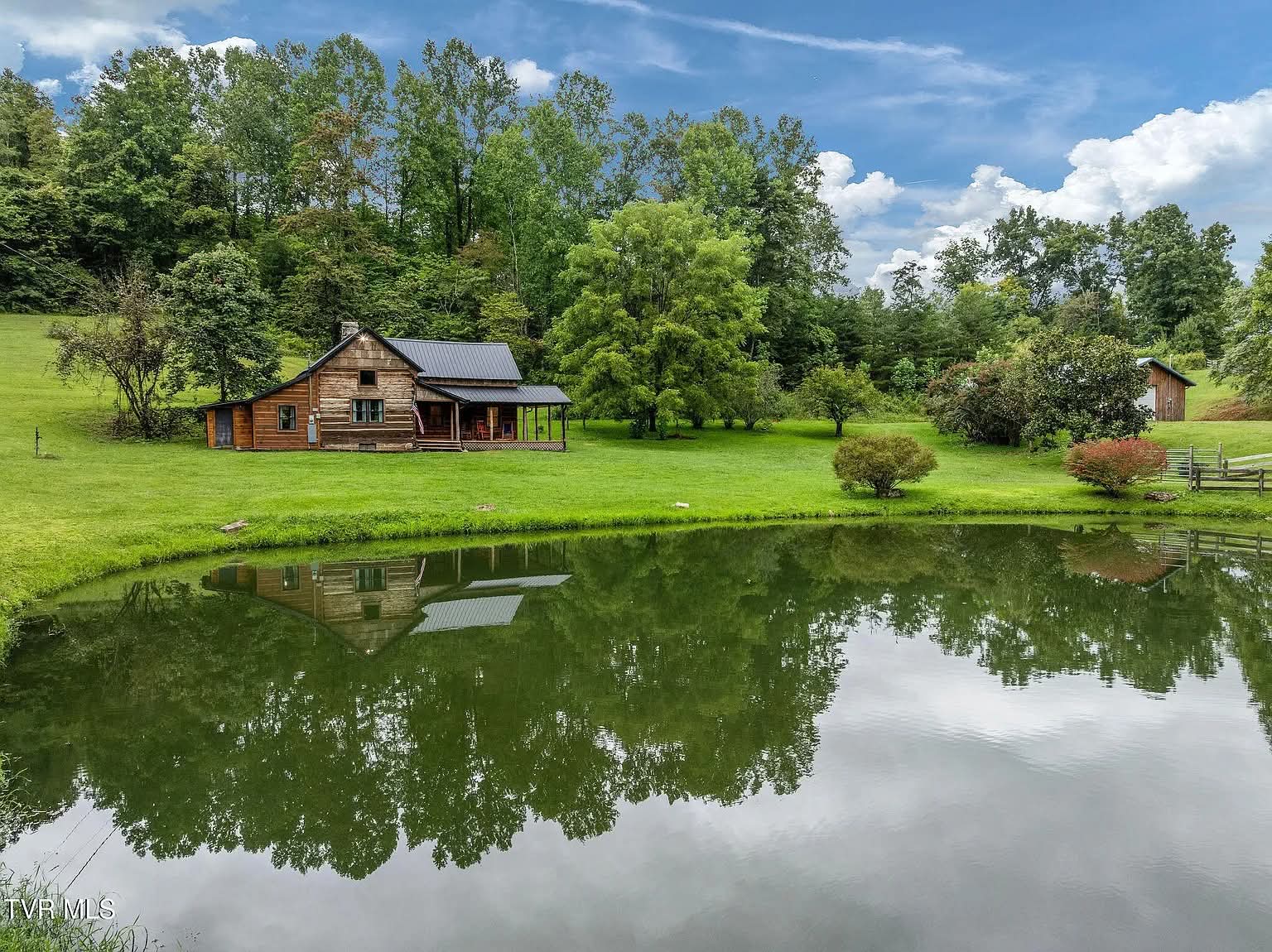 33 Acres with Renovated Cabin, Pond, and Workshop