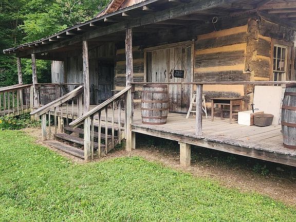 Own a whole village! 10 cabins and 25 acres