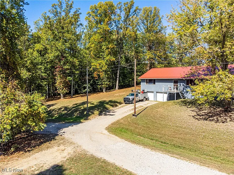 Stunning 54-Acre Nature Retreat with Cabin, Garage, Waterfalls, Cave & Endless Outdoor Adventure