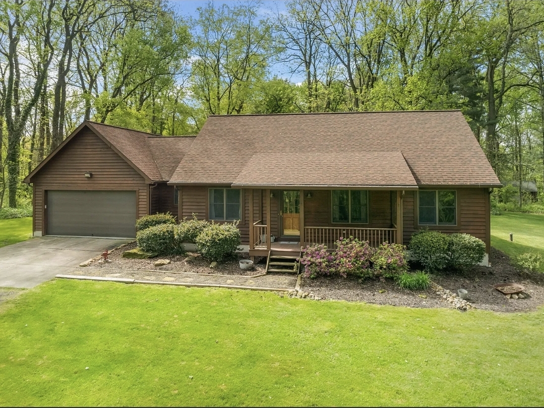 Spacious Split Ranch with Wooded Views, Finished Basement, and Private Owner’s Suite