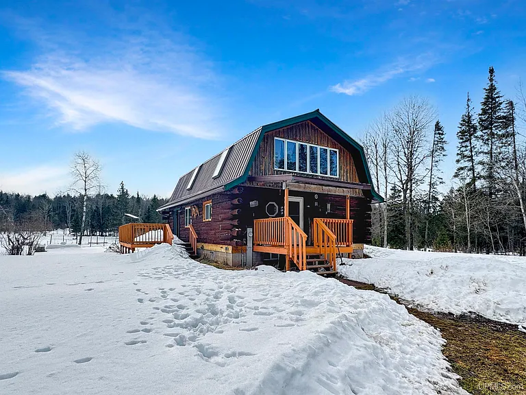 Private 10-Acre Log Home Retreat Surrounded by State Land with Garage
