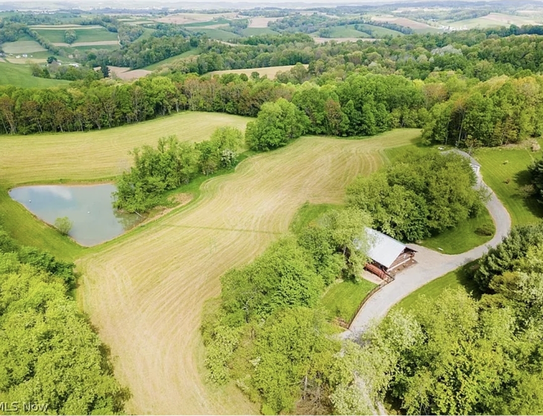 5-Bedroom, 4-Bath Log Cabin Estate on 27.7 Acres with Pond, Workshop, and Recreational Land