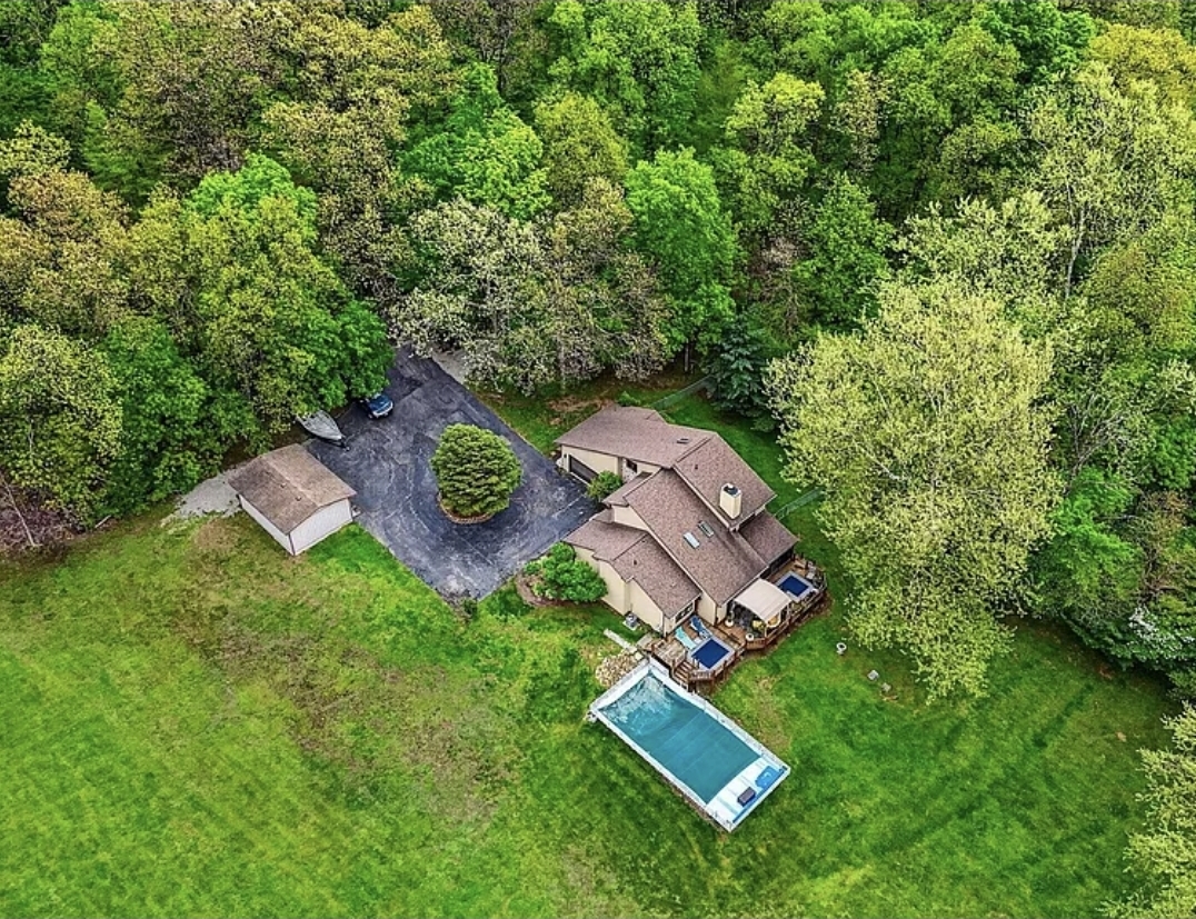 3-Bedroom Home, Creek, Pool, Finished Basement, Two Garages, and Private Wooded Setting