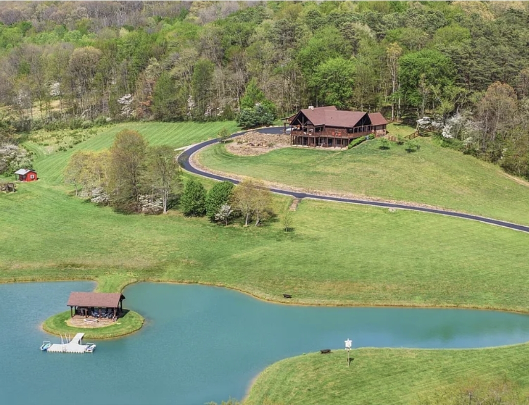 20 Acres with 3 Bedrooms, 3 Bathrooms, Spring-Fed Pond, Barn, and Custom Log Home Retreat