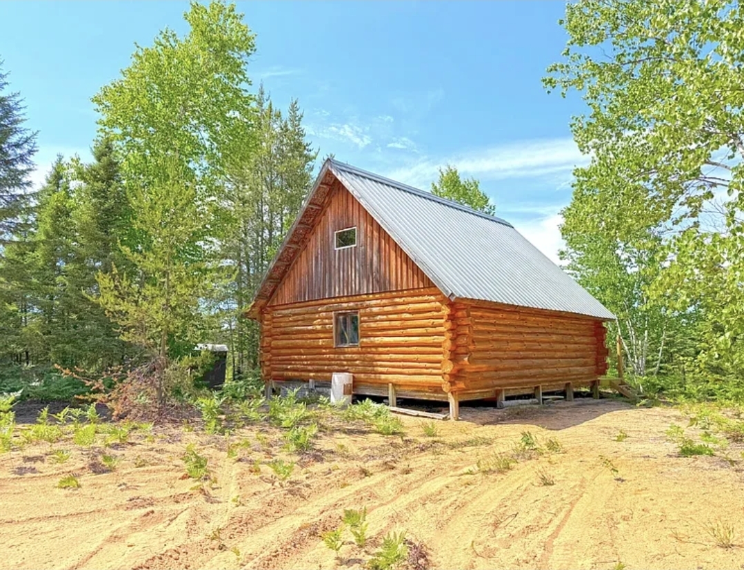 40-Acre Off-Grid Log Cabin with a Sleeping Loft, Wood Stove, and Secluded Wilderness Views