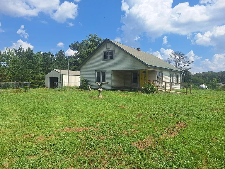 Country Farmhouse on 7 Acres Featuring a Pond and Workshop